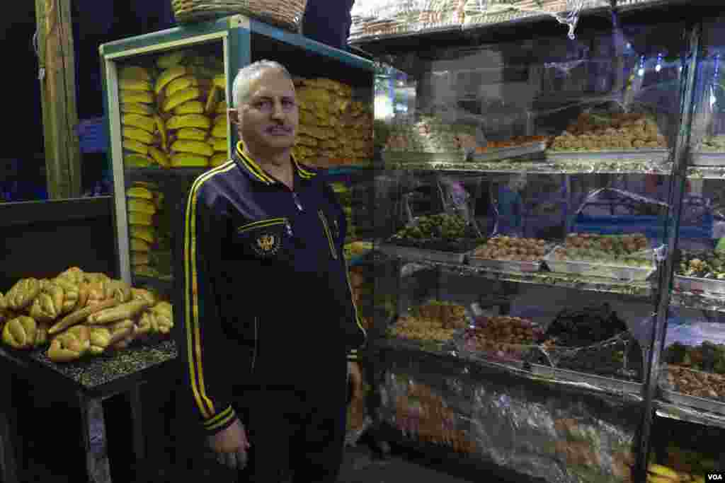 Adel Atta, a baker, says, "While our material costs have doubled and tripled [e.g., wheat, ghee, sugar] since last year, we’re still keeping our prices affordable for our underprivileged neighborhood.” Cairo, Egypt, Jan. 5, 2024. (Hamada Elrasam/VOA)