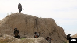 Iraqi forces take part in an anti-Islamic State group operation, launched by the army and the paramilitary Hashed al-Shaabi force, in al-Miqdadiyah, in Iraq's Diyala province, March 10, 2024.