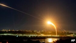 FILE - Ukrainian air defense intercepts a Shahed drone during a Russian aerial attack on Kyiv, Ukraine, May 30, 2023. Ukraine reported April 3, 2024, that Russia fired four drones into Ukraine overnight, but all four drones were destroyed by the Ukrainian air force.