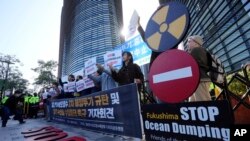 Demonstrators ally to demand the stop of the Japan's release of treated radioactive water from the damaged Fukushima nuclear power plant into ocean, in front of a building which houses Japanese Embassy, in Seoul, South Korea, Oct. 5, 2023. 