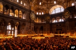 FILE - Muslim worshippers pray during the Muslim holy fasting month of Ramadan at Hagia Sophia mosque in Istanbul, Turkey, April 14, 2023.