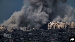 Smoke rises to the sky following an explosion in the Gaza Strip, as seen from southern Israel, March 8, 2024.