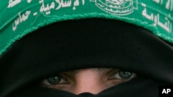 FILE - A Palestinian Hamas supporter attends a protest against Israel's attacks on the Gaza Strip, in Gaza City, on March 3, 2008.