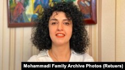 FILE — Iranian human rights activist and the vice president of the Defenders of Human Rights Center Narges Mohammadi poses in this undated handout picture. 