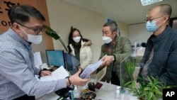 FILE - Peter Møller of the Danish Korean Rights Group submits documents at the Truth and Reconciliation Commission in Seoul on Nov. 15, 2022. (AP Photo/Ahn Young-joon, File)