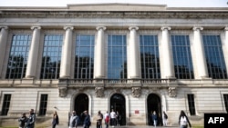 FILE - Students walk across the campus of The Ohio State University in Columbus, Ohio, on Nov. 6, 2023.