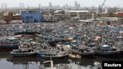 View of anchored fishing boats, after ban imposed on coastal activities following the cyclonic storm, Biparjoy, over the Arabian Sea, at Karachi's Fish Harbor, in Karachi, Pakistan, June 10, 2023.