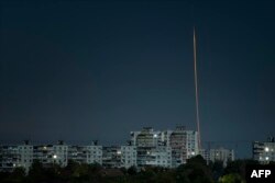 This photograph taken early on Oct. 1, 2023 shows Russian missile launched from Russia's Belgorod region flying towards Kharkiv, eastern Ukraine.