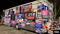 A merchandise bus, selling all sorts of Trump memorabilia, was parked next to the hotel where Donald Trump gave his New Hampshire primary night speech, Jan. 23, 2024. (Carolyn Presutti/VOA)