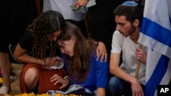 Mourners attend the funeral of Israeli soldier Shilo Rauchberger at the Mount Herzl cemetery in Jerusalem, Oct. 12, 2023.