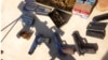 FILE - In this undated photo provided by the United States Attorney's Office for the Eastern District of New York, a cache of weapons and ammunition seized by authorities from the Sinaloa cartel is shown. 