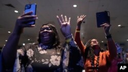 Audience members chant "Four more years" as President Joe Biden speaks at South Carolina's First in the Nation dinner at the South Carolina State Fairgrounds in Columbia, S.C., Jan. 27, 2024. 