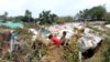 Rohingya refugee children in Cox’s Bazar, Bangladesh, create a makeshift playground amidst the ruins of their shelters after Cyclone Mocha. (Md. Jamal/VOA)