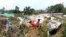 Rohingya refugee children in Cox’s Bazar, Bangladesh, create a makeshift playground amidst the ruins of their shelters after Cyclone Mocha. (Md. Jamal/VOA)