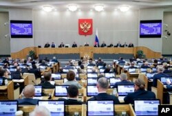 FILE - In this photo released by The State Duma, Russian lawmakers attend a session at the State Duma, the Lower House of the Russian Parliament in Moscow, Oct. 17, 2023.