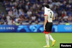 Omar Fayed of Egypt looks dejected after being shown a red card and sent off by referee Said Martinez during the Olympics semifinal soccer match at Lyon Stadium, Decines-Charpieu, France, on Aug. 5, 2024.