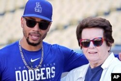 FILE - Los Angeles Dodgers' Mookie Betts, left, and tennis great Billie Jean King are seen during practice ahead of the NLDS, in Los Angeles, Oct. 6, 2023.