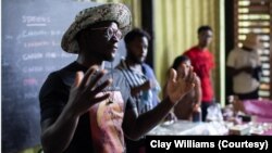 Chef Serigne Mbaye speaks to the crowd at the Afro Freedom/Afro Feast Juneteenth celebration at Grow Dat Youth Farm in New Orleans on June 19, 2023. Mbaye works to spotlight African-influenced cuisine at his New Orleans restaurant Dakar NOLA.