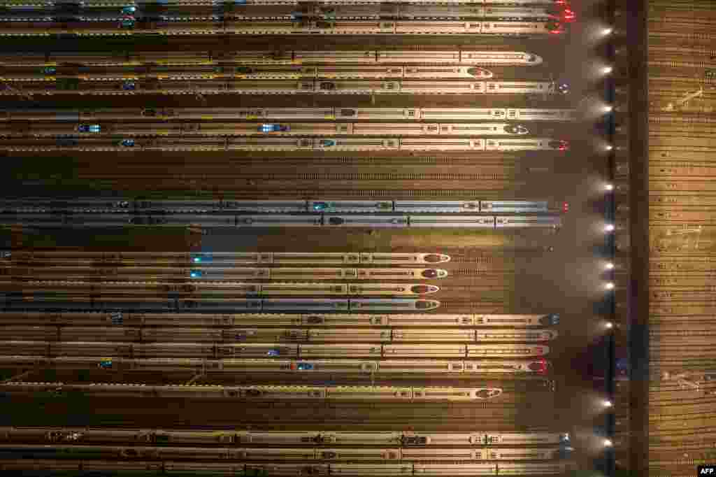 This aerial photo shows bullet trains parked at Nanjing south railway station in Nanjing, in eastern China&#39;s Jiangsu province.