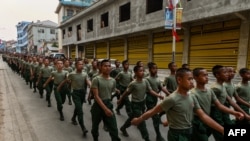 ภาพจากเมื่อวันที่ 17 เมษายน 2019 เเสดงให้เห็นถึงทหารของกองทัพ United Wa State Army ระหว่างการฉลองครบรอบ 30 ปี ความตกลงหยุดยิงกับกองทัพรัฐบาลเมียนมา ในรัฐว้า