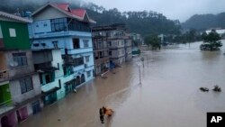 Flood waters inundate buildings along the Teesta River in Sikkim, India, Oct. 4, 2023. 