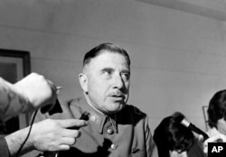 FILE - Gen. Augusto Pinochet, head of he Santiago, Chile military garrison, announces measures for the state of emergency installed by the government after rioting in downtown Santiago, Dec. 2, 1971.