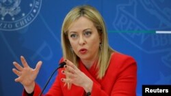 FILE - Italian Prime Minister Giorgia Meloni speaks in Rome. Meloni offered her solidarity with the journalist, Andrea Joly, was beaten up in the northern city of Turin by suspected neo-fascists.