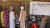 FILE - People wait to cast their votes during a constitutional referendum at a polling station in N'Djamena, Chad, Dec. 17, 2023. The country's electoral commission has set May 6, 2024, for a presidential poll.