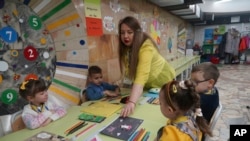 A class is taught underground in a subway station in Kharkiv, Ukraine, Jan. 20, 2024. Officials opened such sites to protect kids from Russian missile strikes. Even in wartime, there is excitement for Ukraine's future, journalist Dominic Culverwell says.