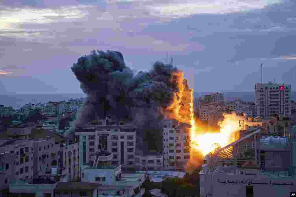 Fire and smoke rise following an Israeli airstrike, in Gaza City, Oct. 7, 2023.