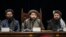 FILE - Taliban acting Defense Minister Mohammad Yaqoob Mujahid, center, speaks at a press conference in Kabul, Afghanistan, Dec. 31, 2023. 