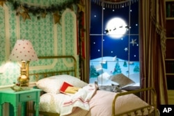 Holiday decorations adorn the Library of the White House for the 2023 theme "Magic, Wonder, and Joy," Monday, Nov. 27, 2023, in Washington. (AP Photo/Evan Vucci)