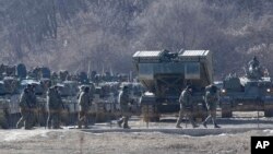 South Korean soldiers pass armored vehicles during a military exercise in Paju, near the border with North Korea, Jan. 24, 2024. North Korea said Jan. 25 that it had conducted its first flight test of a new cruise missile. 