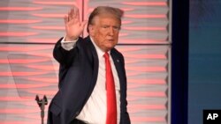 Former US President Donald Trump acknowledges attendees after speaking at the Republican Party of Florida Freedom Summit, Nov. 4, 2023, in Kissimmee, Fla.