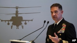 FILE - U.S. Navy Vice Adm. Brad Cooper, who heads the Navy's Bahrain-based 5th Fleet, speaks at an event at the International Defense Exhibition and Conference in Abu Dhabi, United Arab Emirates, Feb. 21, 2023. 