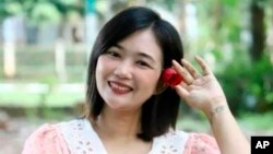 FILE - Journalist Hmue Yadanar Khet Moh Moh Tun poses for a photo in Yangon, Myanmar, in January 2021. 