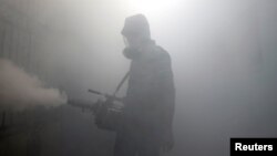 A health worker fumigates in a residential area, as Sri Lanka tries to curb dengue fever across the island in Colombo, Sri Lanka, July 12, 2023. 