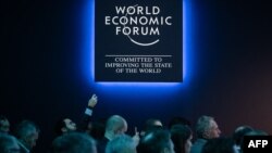 FILE - Participants are seen during a session of the annual World Economic Forum in Davos, Switzerland, Jan. 17, 2023. The Alpine resort will host this year's World Economic Forum from Jan. 15 through Jan. 19, 2024.
