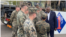 U.S. Secretary of Defense Lloyd Austin, right, visits troops taking part in Exercise Talisman Sabre in Townsville, Australia. "We are grateful for everything that you are doing," he said.