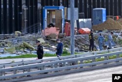 Istražitelji ispituju zgradu oštećenu u navodnom napadu dronovima na Moskvu, Rusija, 24. jula 2023.