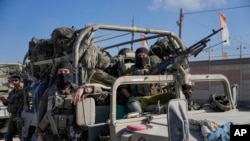 Israeli army troops are seen on the Israeli-Gaza border during a ground operation in the Gaza Strip, Nov. 8, 2023. 