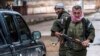 FILE - Christian fighters of Sutoro carry their weapons at a checkpoint in Tel Tamr, Syria, Feb. 25, 2015. Local reports said three members of Sutoro were killed in Turkish drone strikes on Derik, Syria, Feb. 28, 2024.
