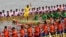 Participants row dragon boats during a competition as part of the Water Festival on the Tonle Sap river in Phnom Penh on November 26, 2023.