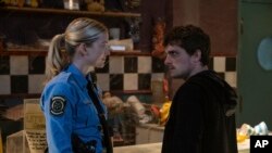 This image released by Universal Pictures shows Elizabeth Lali and Josh Hutcherson in a scene from "Five Nights at Freddy's." (Universal Pictures via AP)