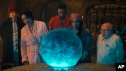 This image released by Disney Enterprises shows, from left, Owen Wilson, Rosario Dawson, LaKeith Stanfield, Tiffany Haddish and Danny DeVito in a scene from "Haunted Mansion."