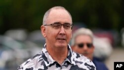 FILE — United Auto Workers President Shawn Fain talks in Delta Township, Michigan, Sept. 29, 2023. The union said Friday it will not expand its strikes against Detroit's three automakers after GM made a breakthrough concession on unionizing electric vehicle battery plants.