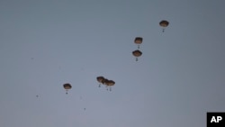 Humanitarian aid is dropped by the United States over Gaza City, Gaza Strip, March 2, 2024.