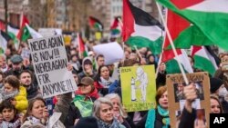 Demonstrators rally against Israel's President Isaac Herzog attending the opening of the new National Holocaust Museum in Amsterdam, Netherlands, March 10, 2024.