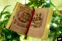 Holiday decorations adorn the library of the White House for the 2023 theme "Magic, Wonder, and Joy," Monday, Nov. 27, 2023, in Washington. (AP Photo/Evan Vucci)