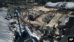 A farm storage building is seen damaged after a Russian attack in the Odesa region, Ukraine, July 21, 2023. Missiles injured two people, damaged equipment and destroyed 100 metric tons of peas and 20 metric tons of barley, regional Gov. Oleh Kiper said. 